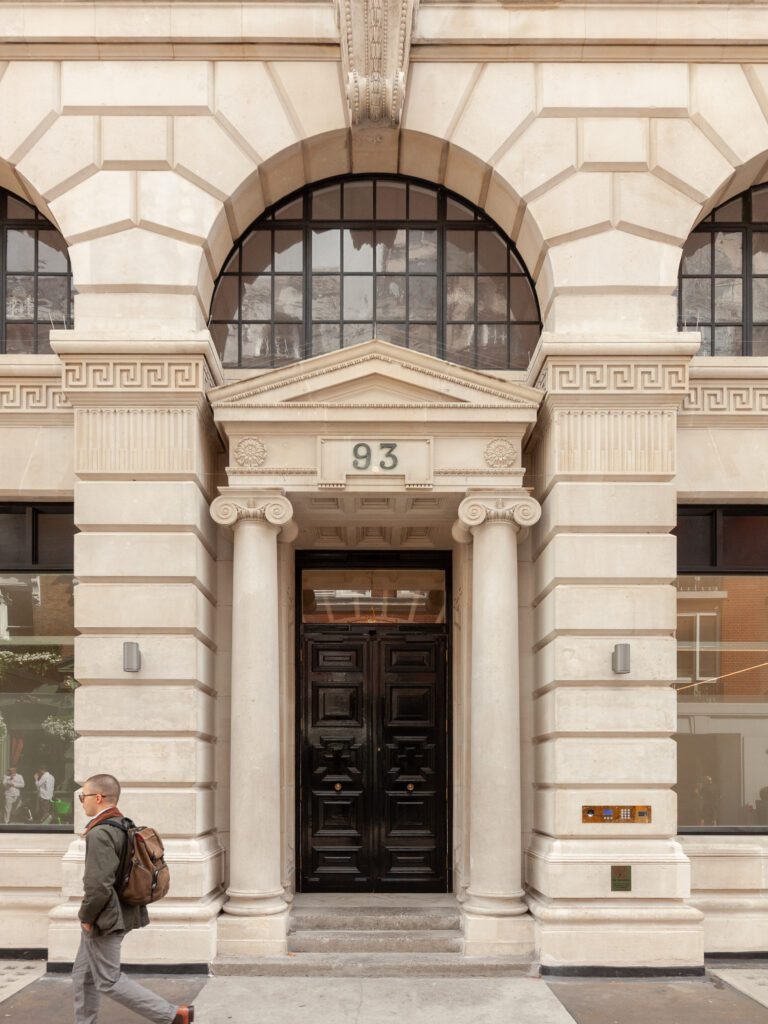 Exterior of a Fitzrovia period property with vintage brickwork and arched windows